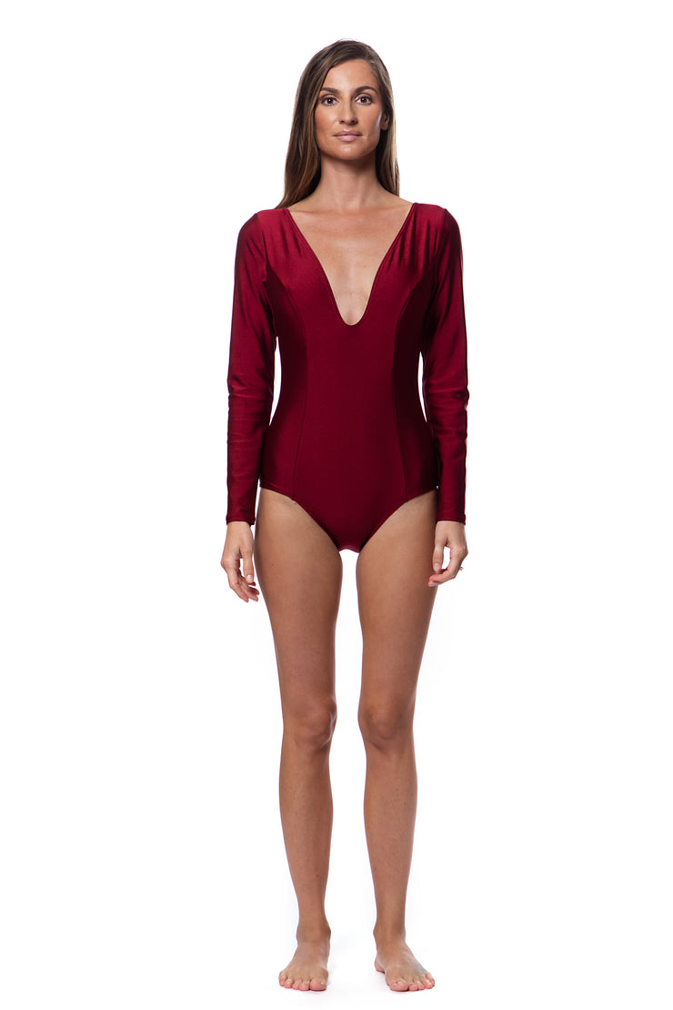 Bella Paradise luxury long sleeve one piece swimsuit in deep cardinal red with a plunging neckline
