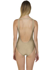 Back view of a model wearing a beige luxury one piece swimsuit with a deep scoop back