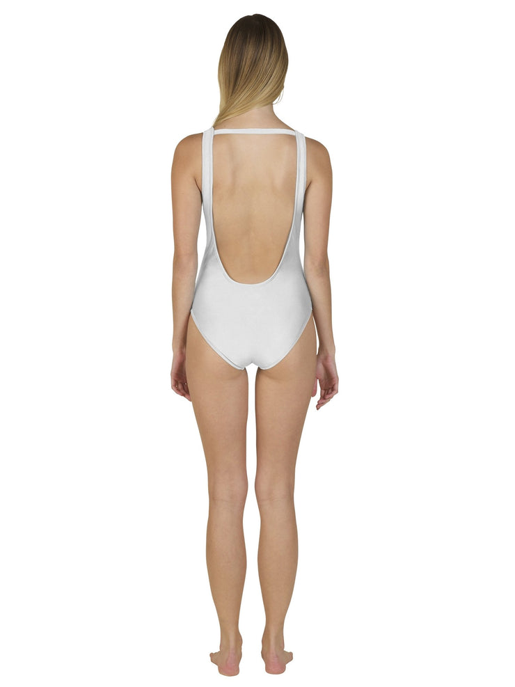 Back view of luxury one piece swimsuit in white worn by model showcasing low scoop back design