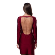 Back view of woman wearing a deep back cardinal red luxury resort skirt by Bella Paradise in color print size