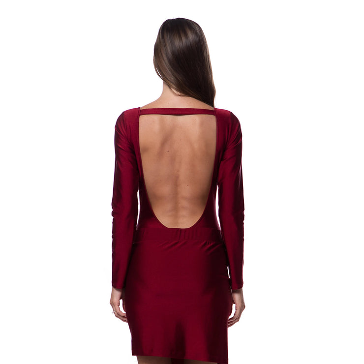 Back view of woman wearing a deep back cardinal red luxury resort skirt by Bella Paradise in color print size