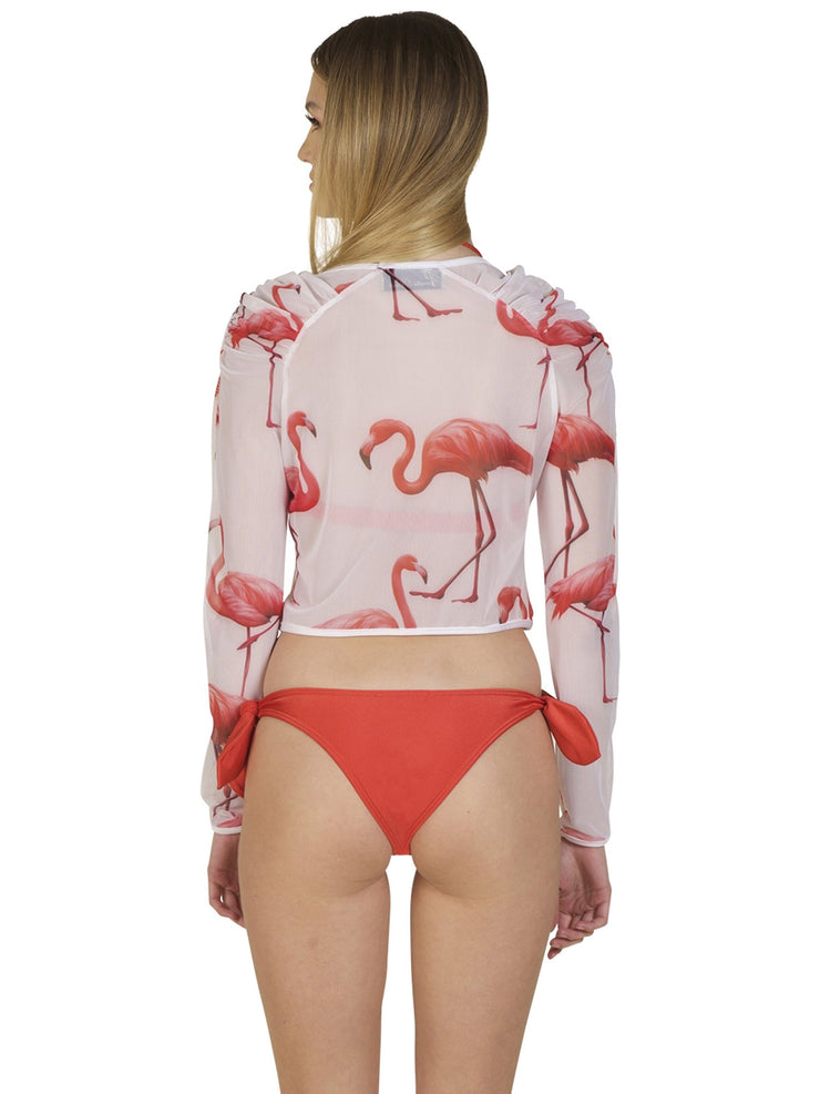 Back view of woman wearing Bella Paradise tropical mesh crop top for women with pink flamingo print