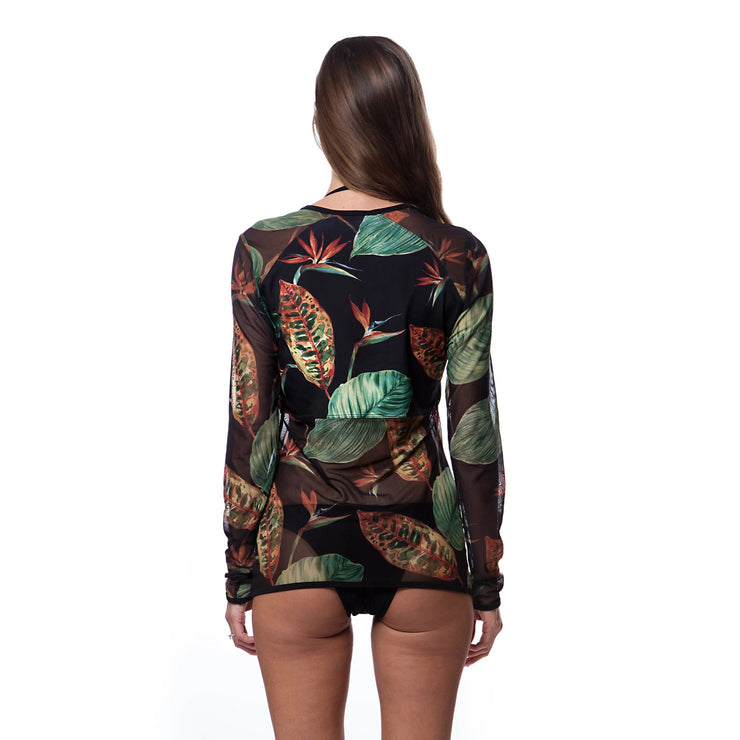 Bella Paradise long sleeve tropical rash guard with colorful leaf print worn from back