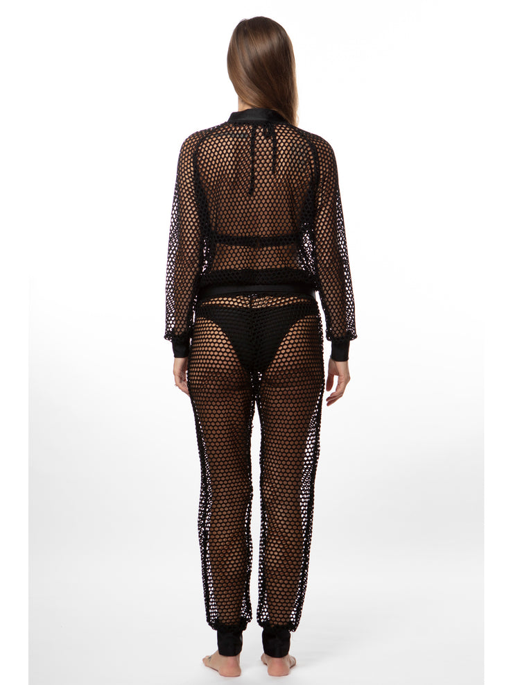 Back view of woman wearing Bella Paradise luxury mesh bomber jacket and matching mesh pants in black