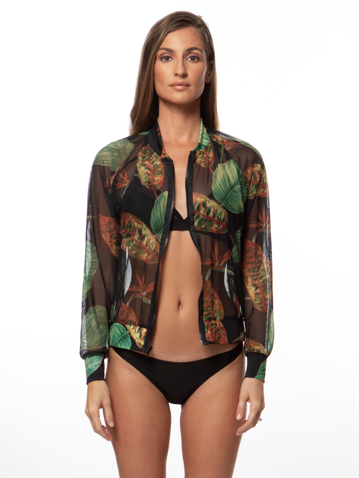 Bella Paradise tropical print mesh bomber jacket with green and orange leaf design worn by model