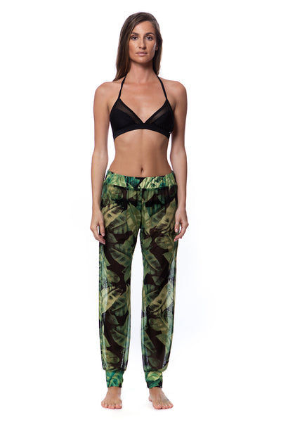 Bella Paradise versatile mesh cover up pants in green leaf print worn by model with black bikini top