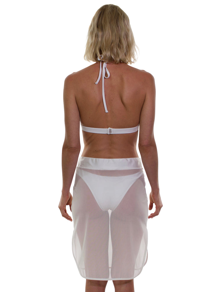 Bella Paradise white sheer beach cover up skirt worn by a woman from the back with bikini