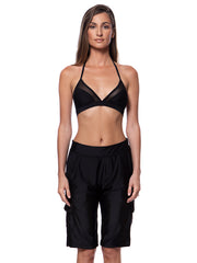 Bella Paradise women's board shorts in black color print size worn by model with black halter bikini top