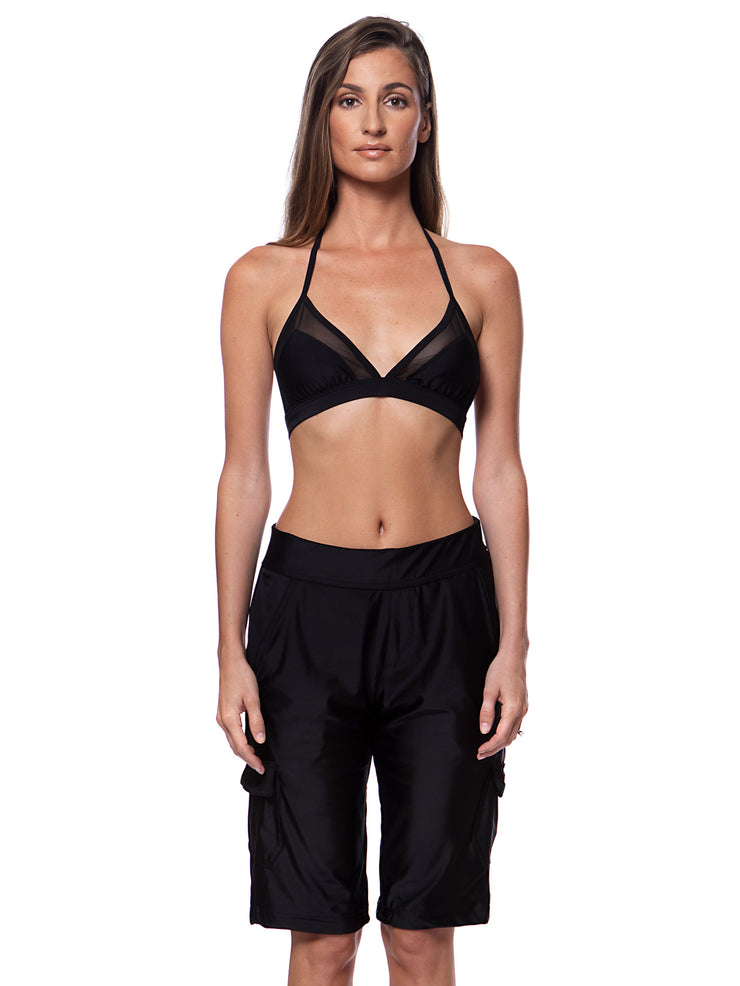 Bella Paradise women's board shorts in black color print size worn by model with black halter bikini top